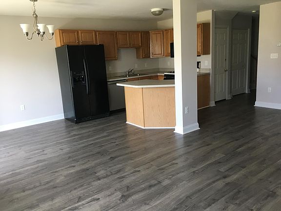 Open floor plan featuring kitchen, dining area, and family r
