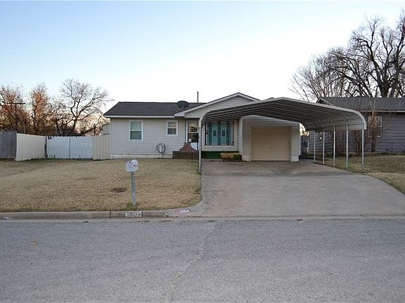 Street view. ! car attached, 2 car carport and parking in 2 story shop in back yard.