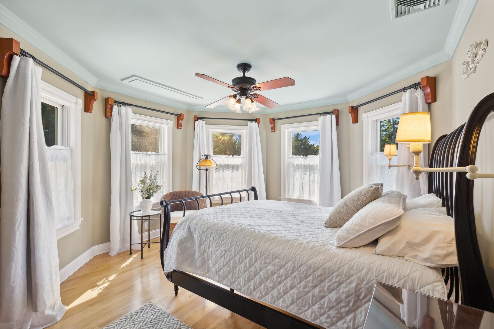  Primary Bedroom En Suite. A Flat Screen Television Lowers from Ceiling in Front of Bed
