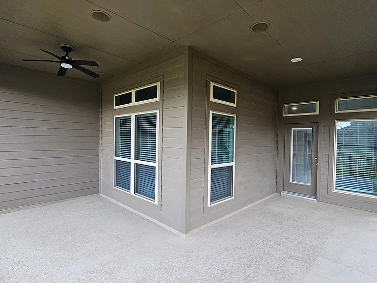 Oversized back porch, equipped with a ceiling fan and outdoor speakers. Perfect for entertaining, or relaxing.