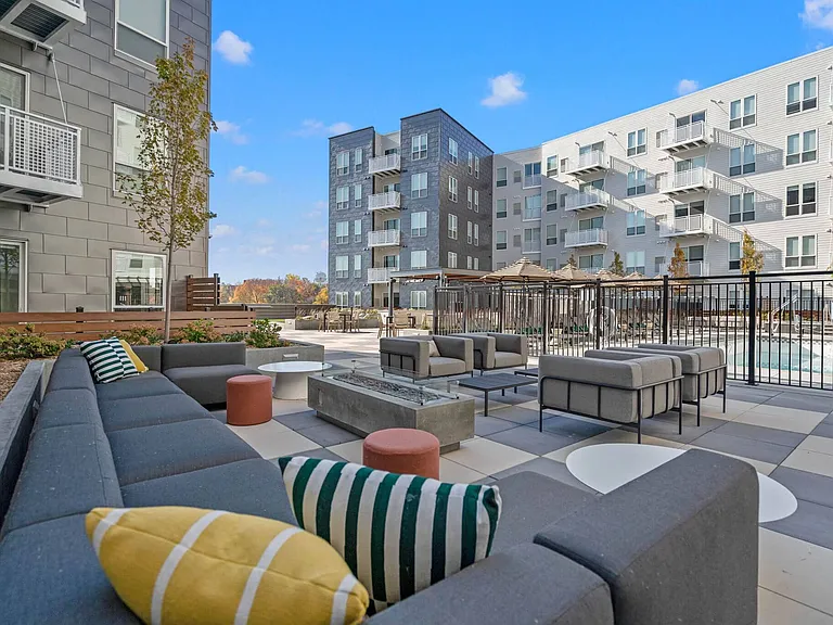 Enjoy a beautiful day on our rooftop amenity deck lounge at The Hallon Luxury Apartments in Hopkins MN
