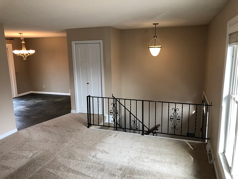 Entry closet at top of stairs.