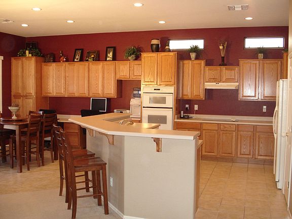 features: stovetop, wall oven/micro combo, extended cabinets, huge island