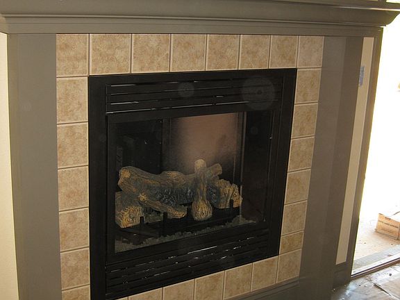 Neat tiled Gas Fireplace