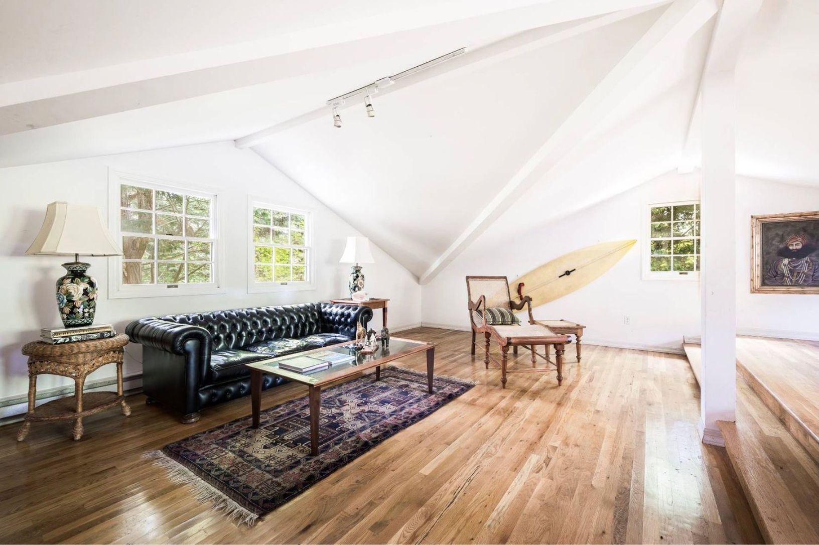 upstairs studio above garage with twin daybed, set up with TV, used for extra space