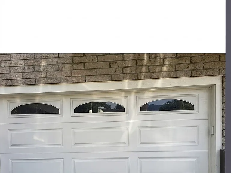 Electric garage door with EV charging station