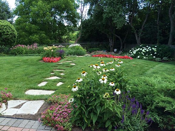 Flagstone walkway leading to lower flagstone patio