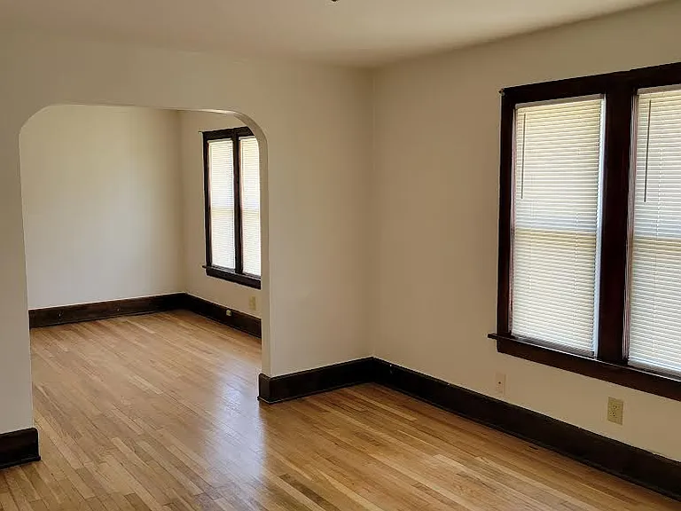 Dining room leading to living room and new windows.