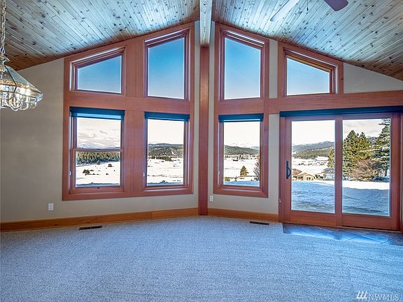 Views for days. Sunsets cannot be beat from this Northwest facing home. Absolutely stunning. Both the living area & the family/rec room have sliders to access the wrap around front porch.