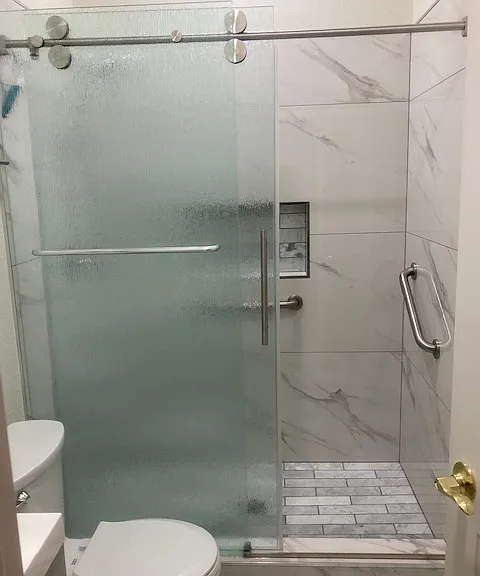 Glass sliding door shower