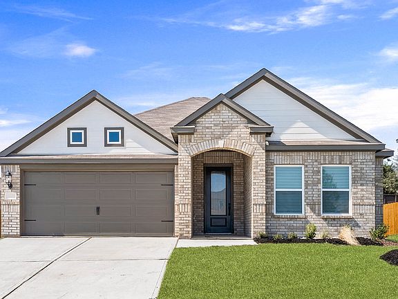 Beautiful one-story home with a brick exterior and siding detals.