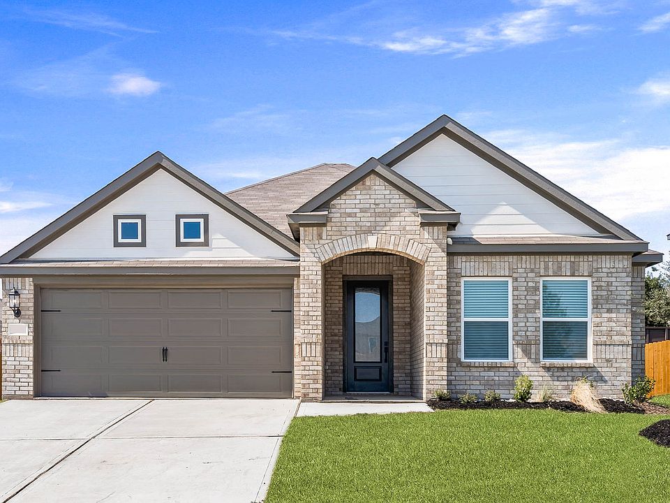 Beautiful one-story home with a brick exterior and siding detals.