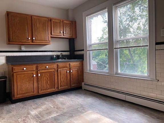 Side kitchen with plenty of sunshine and light.