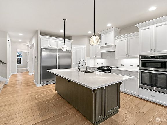 Gather Around the Spacious Island, Entertain Guests & Enjoy the Open Living Space>