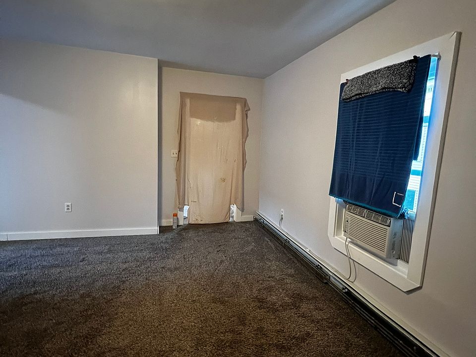 Living room facing kitchen area.