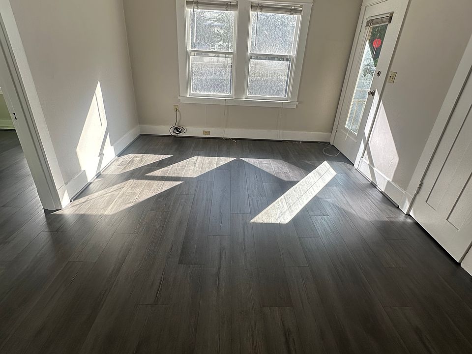 Entry + Living room, note tall ceilings, new floors, trim