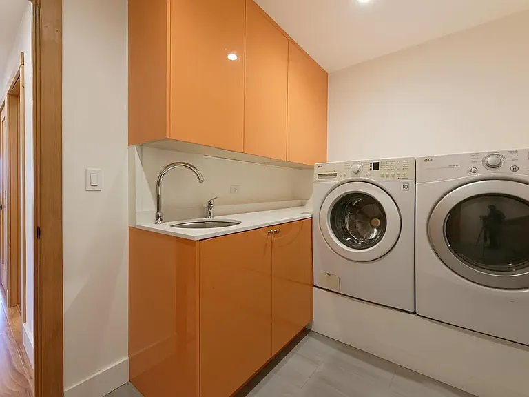 Separate laundry room with sink and storage on first floor (appliances not included with rental)