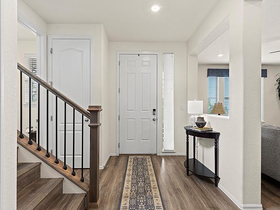 Entry way, power room and stairs to the left, LR to the right