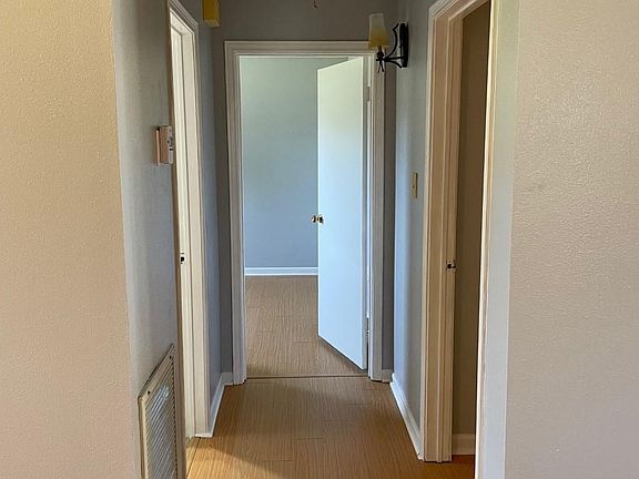 Hallway to bedrooms and common bathroom