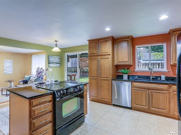 Granite countertops, island and undermount sink are just a few of the updated features of the kitchen.