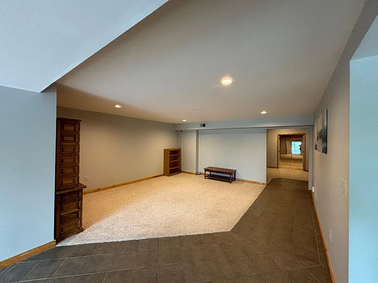 LIving Room, TV area. Tile leads to bedrooms and bath.