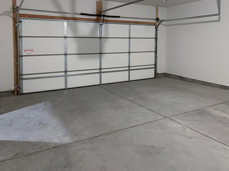 Enjoy the convenience of an attached garage, offering covered parking and extra storage space.