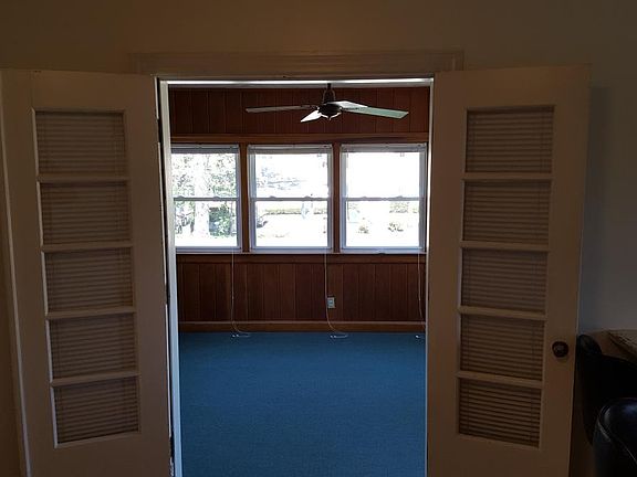 dining room opens to beautiful sun room