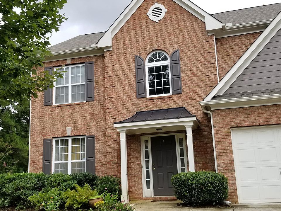 Front view with 2 car garage
