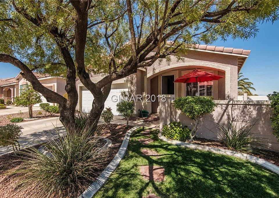Gorgeous curb appeal and landscaping in the gated GVRanch corner home!