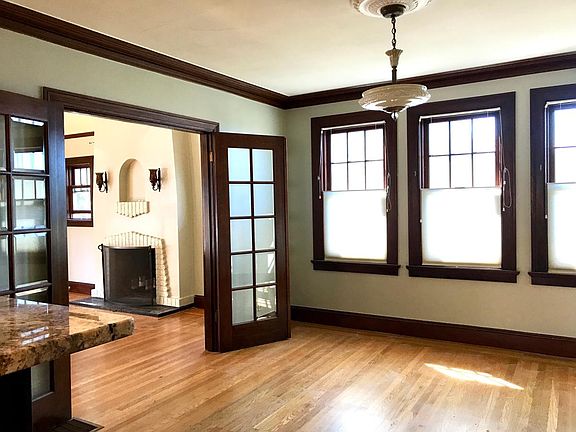Dining room connects through beveled glass doors to living r