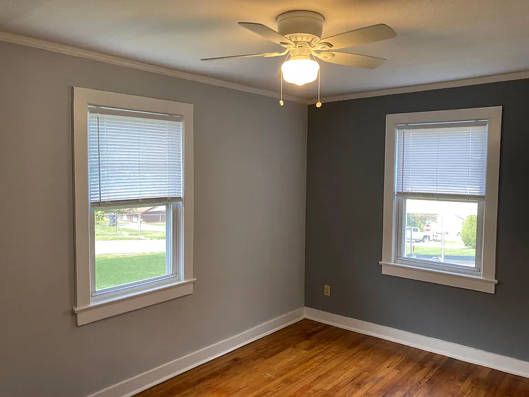 Main bedroom windows and ceiling fan.