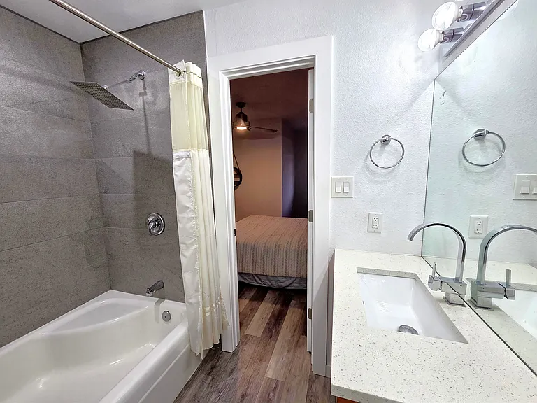 Upstairs Jack and Jill style bathroom with dual vanity and rain shower
