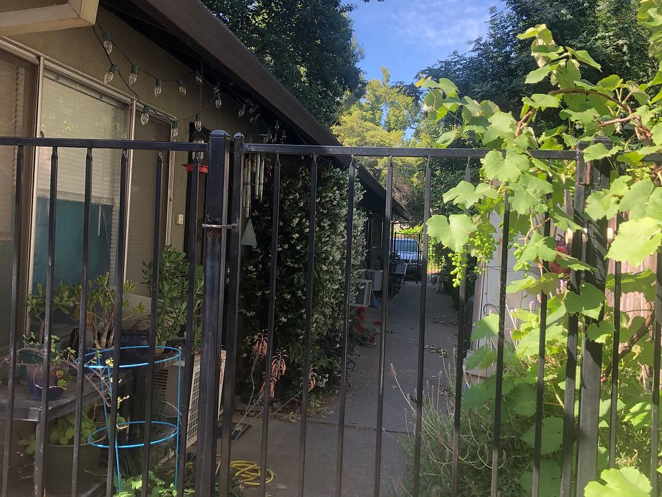 Iron gates at both ends of the walkway to units make access more private.