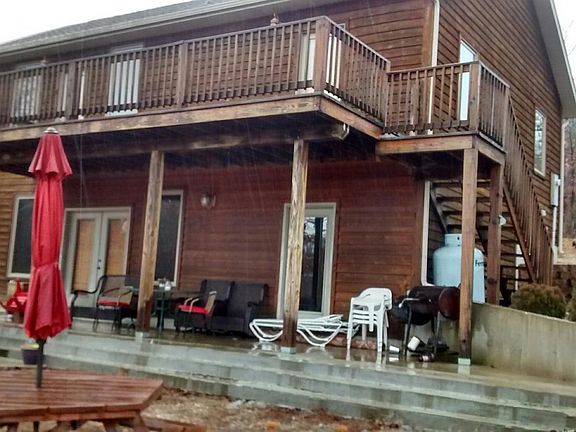 Back of house with walk out 