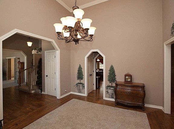 Arch doorways with decorative trim and moldings