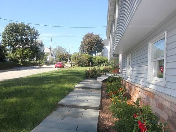 House exterior with bluestone steps to front door, includes new smart locks.