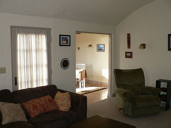 Living room looking to entry and dining area