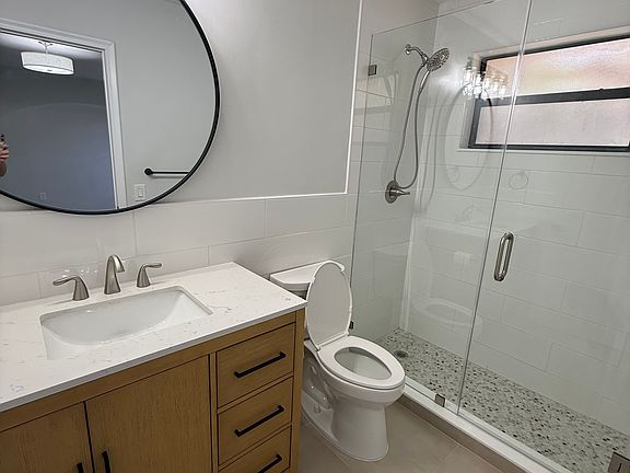 Master bath with glass shower door enclosure