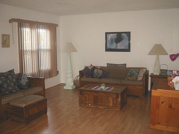 FAMILYROOM WITH SLIDERS THAT LEADS TO BACKYARD PARADISE