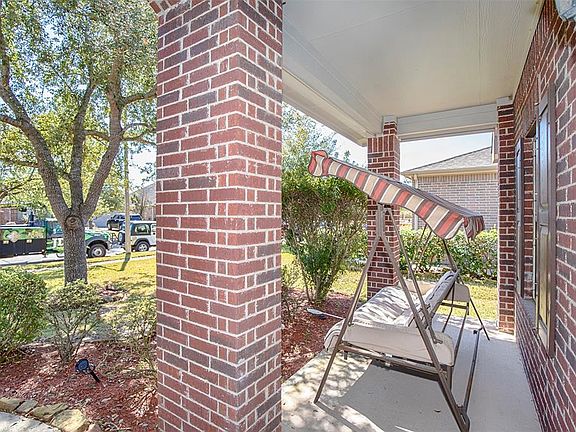 Spacious front porch that can fit a couple of chairs and a small table.