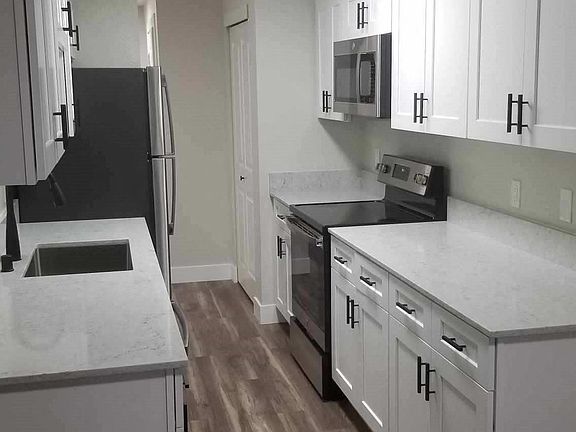 White Cabinets, New Stainless Appliances