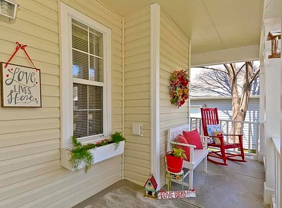 Sit and relax on this adorable front porch. Vinyl siding installed in 2015.