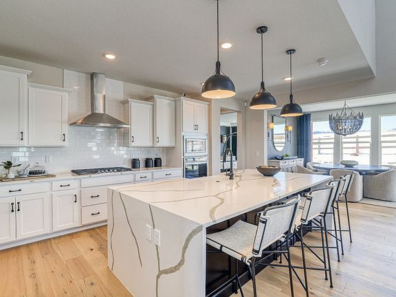 Upgrade the Messina kitchen when you select our stunning waterfall edge island and pendant lighting.
