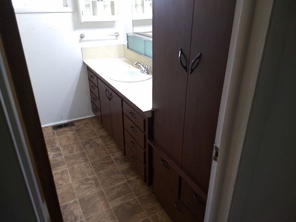 Newer vinyl floor refinishedcabinets