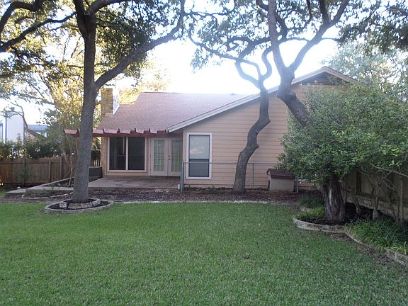 View of back of duplex with good size patio.
