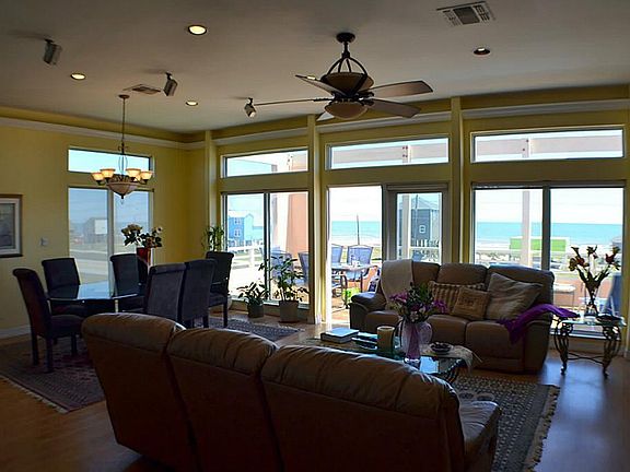 View of living and dining from the kitchen. Wall of windows!