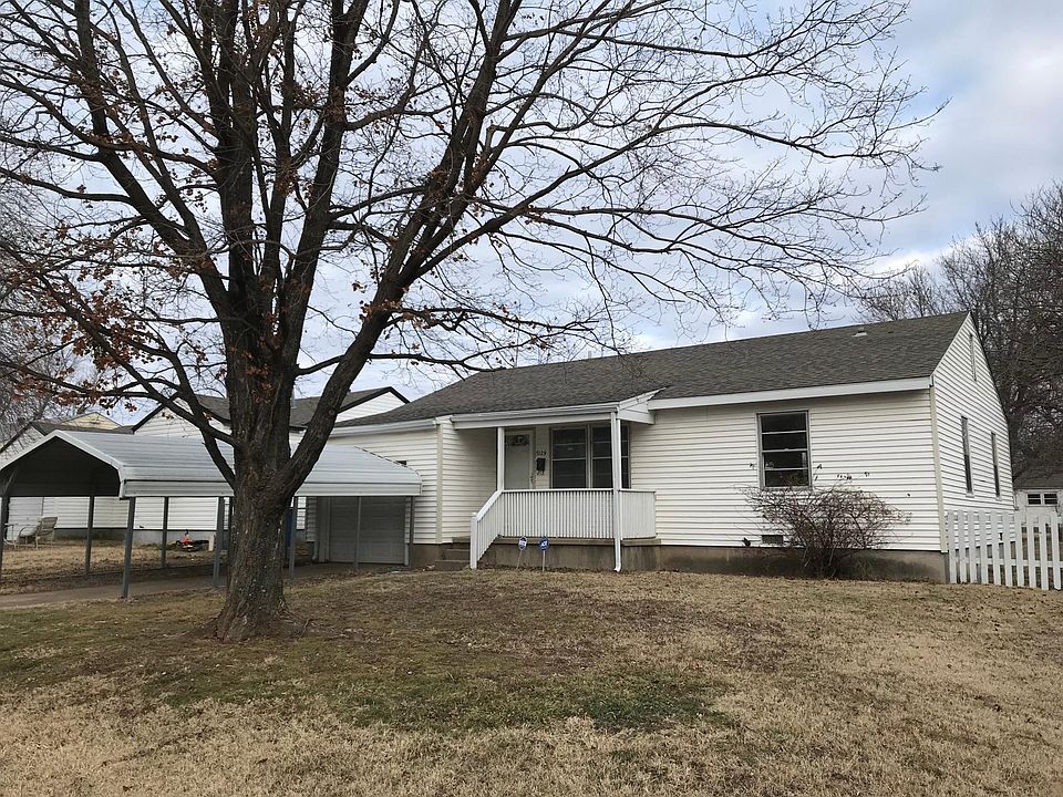 Front view with covered parking
