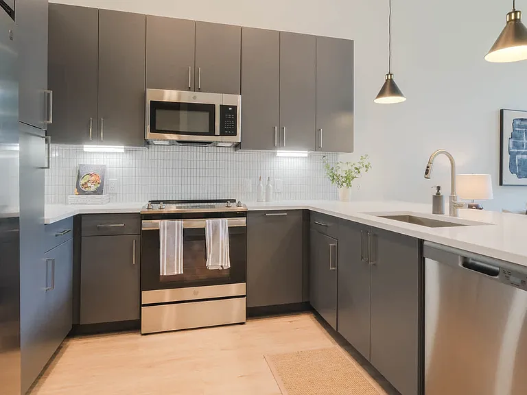 Kitchen with Stainless Steel Appliances and Dark Cabinets