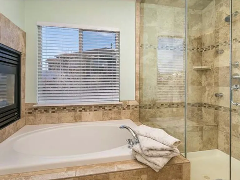 Master bath with steam shower, garden bathtub and large walk in closet