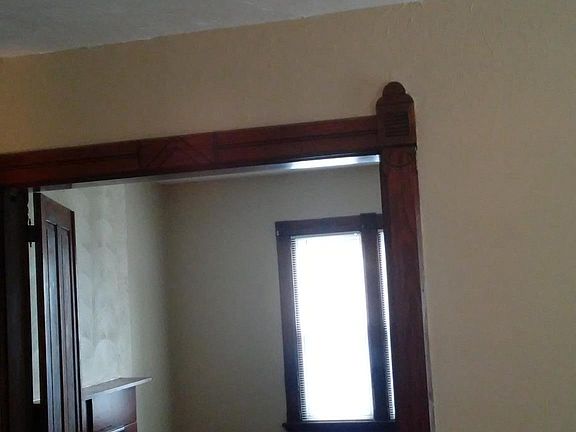 Beautiful front room (or 4th bedroom) with original handcraf